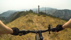 A first-person point of view of someone mountain biking in Washington near Leavenworth.