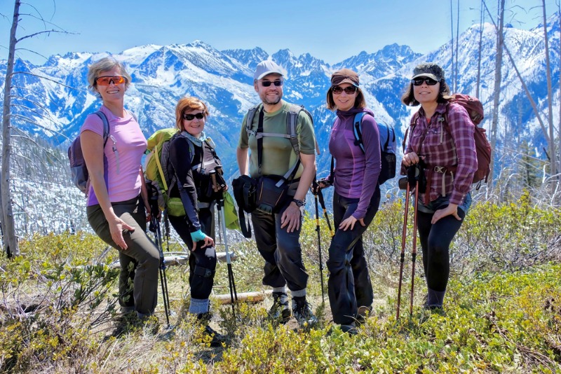 Best Last Minute Destinations: A group of hikers pose near the Cascade Mountains on a trail near Leavenworth, WA.