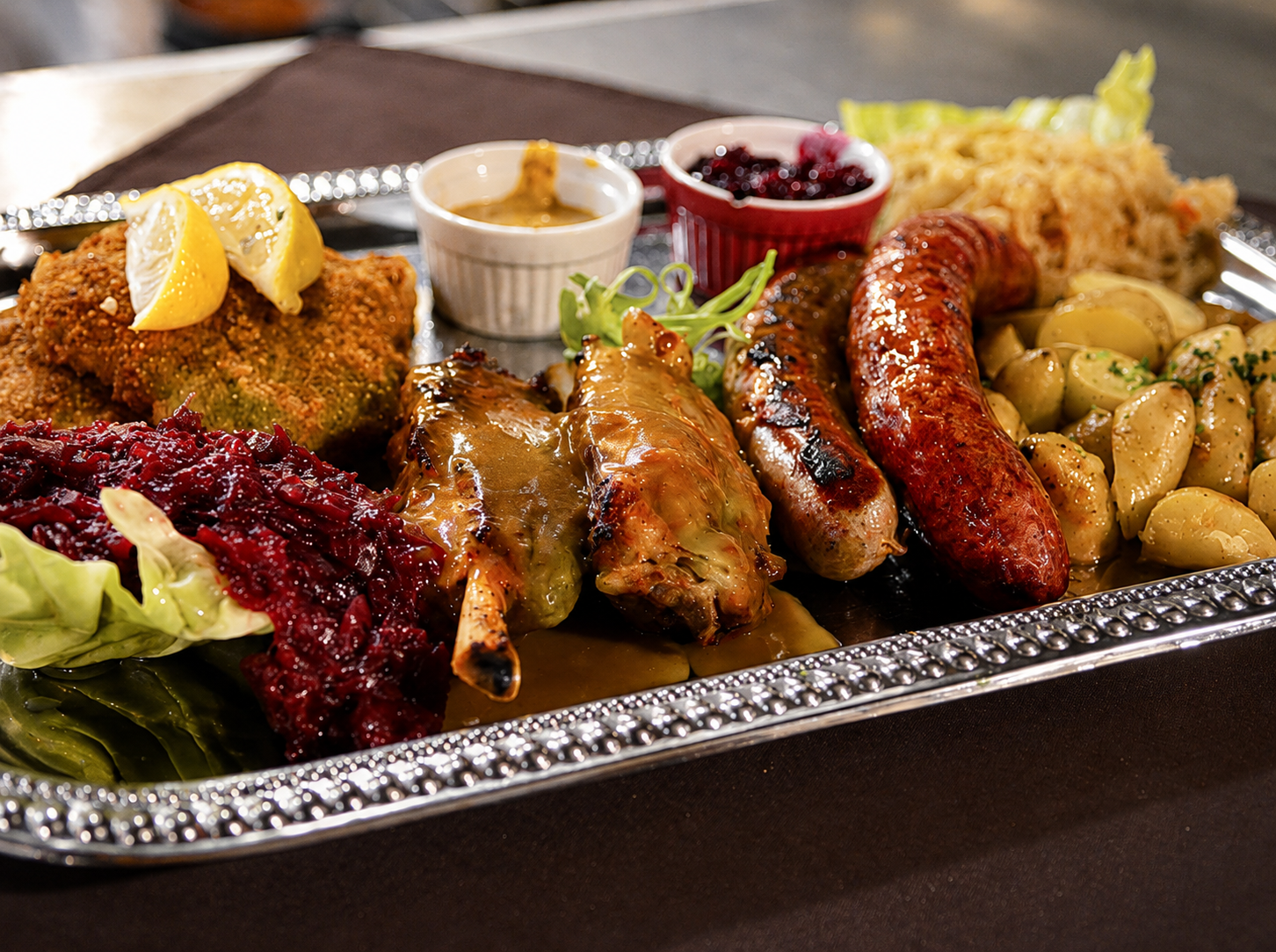 German platter with sausages, schnitzel and sides