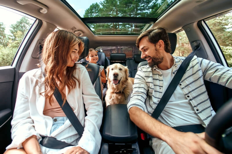 A young family eagerly drives to their pet-friendly cabin in Leavenworth, WA.